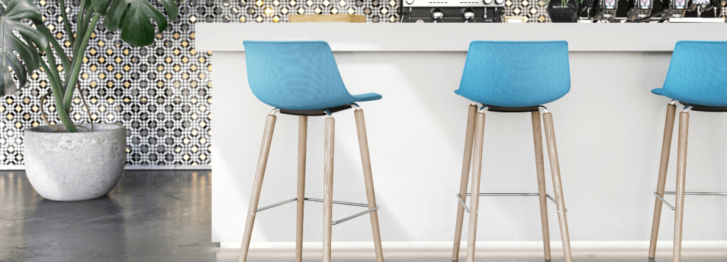 Modern SHUFFLEis1 Stool by Interstuhl. Blue fabric seat with light wood legs and metal detail. Contemporary design.