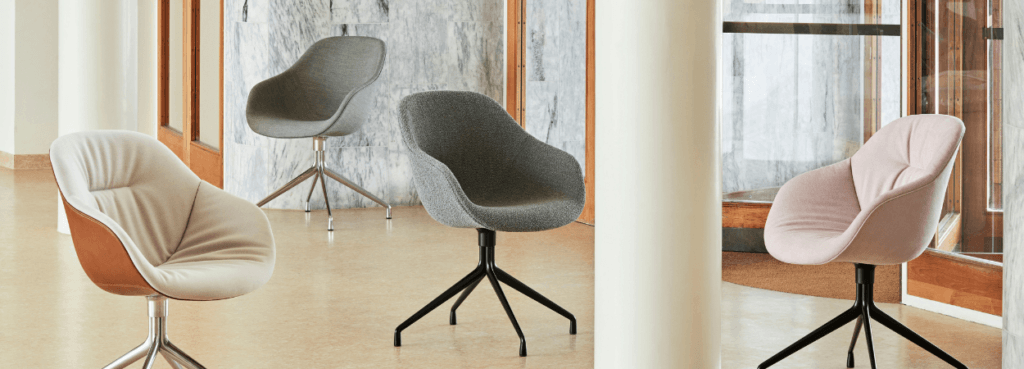 HAY AAC 121 swivel chairs in various colors and finishes, perfect for modern offices.