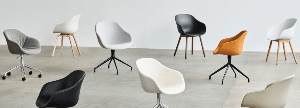 Variety of HAY AAC 222 chairs in different colors, bases, and materials. Modern design for any space.