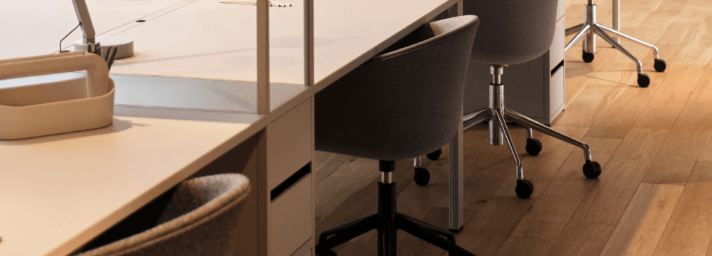 HAY AAC 53 executive chair in gray fabric with a five-legged castor base in a modern office setting.