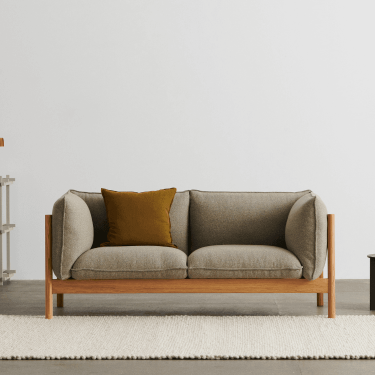 HAY Arbour Sofa Collection: Scandinavian design with wooden frame and neutral upholstery.
