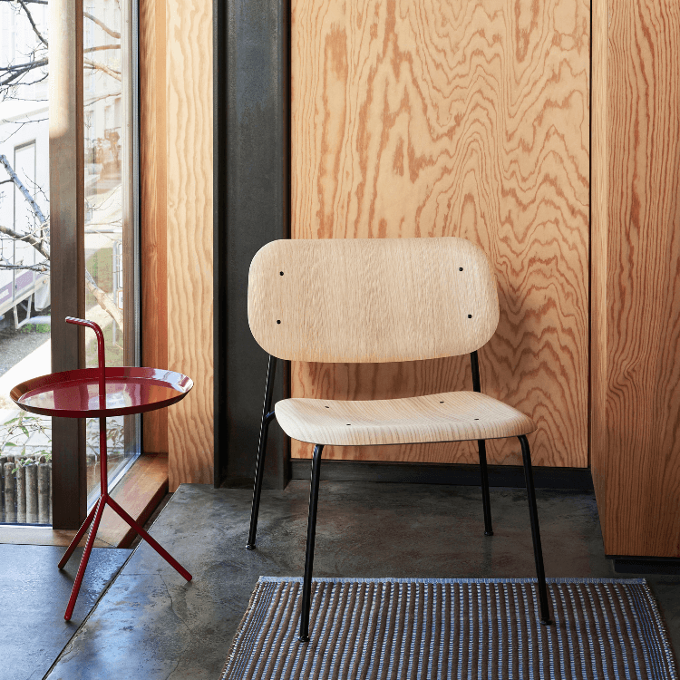 HAY Soft Edge 100 chair. Light wood seat, black steel base. Modern design for social spaces in Cyprus.