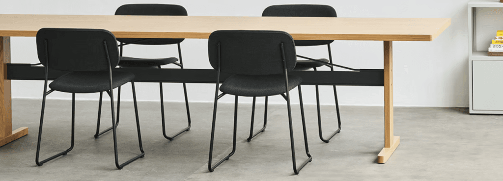 Soft Edge 51 chair. Black seat/back, steel sled base. Modern, stackable design.