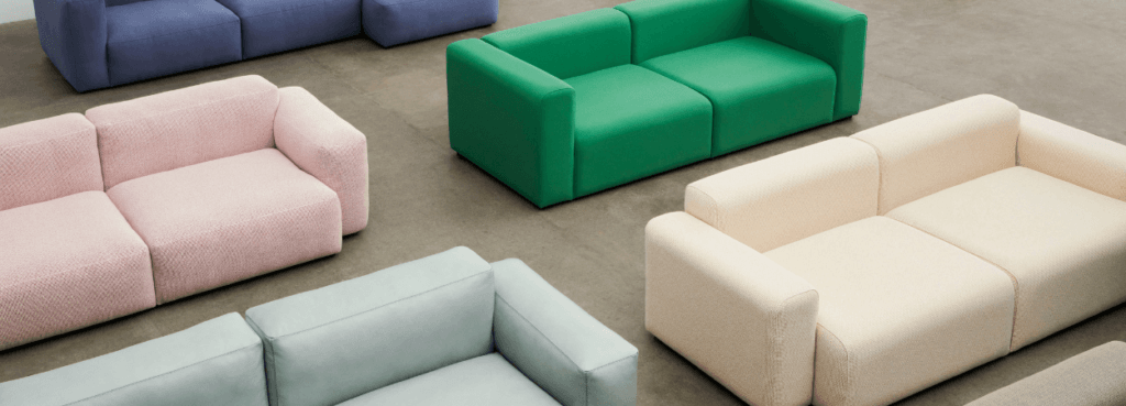 HAY Mags Low Armrest Sofa, modular seating in blue, pink, green, light blue and cream colors.