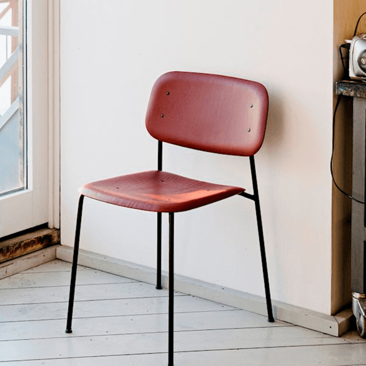 HAY Soft Edge 40 chair. Red wood seat and back, black steel frame. Minimalist design.