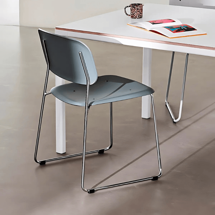 HAY Soft Edge 55 chair. Blue plastic seat/back with steel sled base. Modern design.