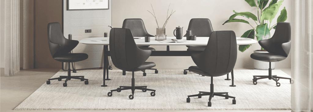 CHECKis3 lounge chair in black leather around a modern conference table.