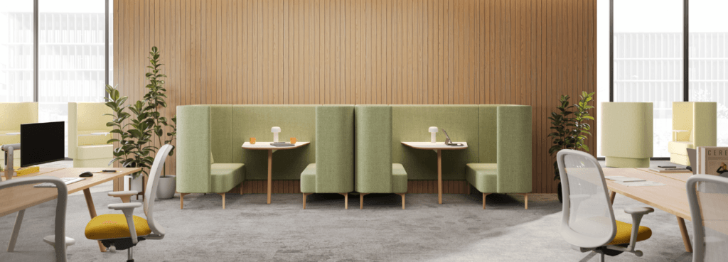 Modern office featuring green NaughtOne Pullman Chair booths with tables.