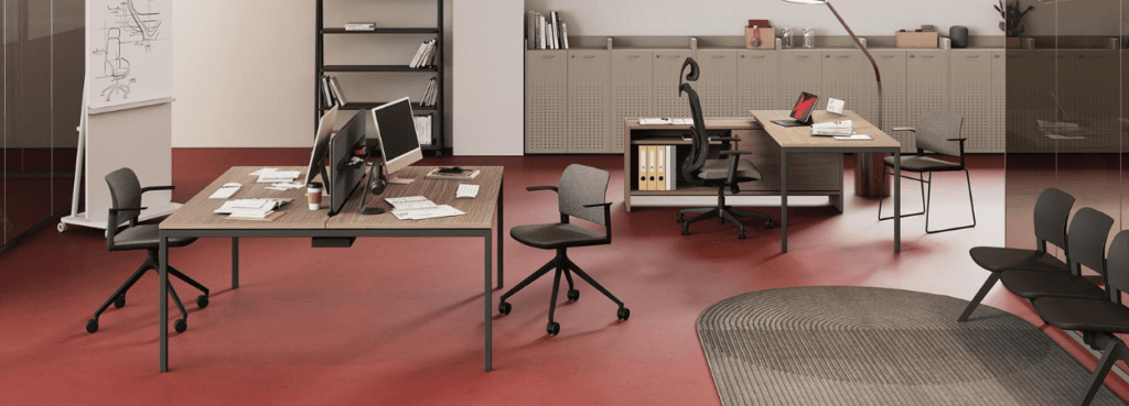 Modern office space featuring SIGMA desk system. Minimalist design with wood and metal accents.