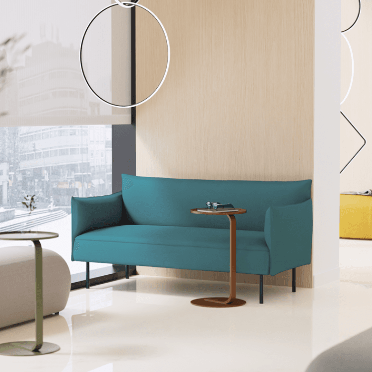 Alea S50 Collection sofa in teal with side tables. Customizable seating for reception areas.