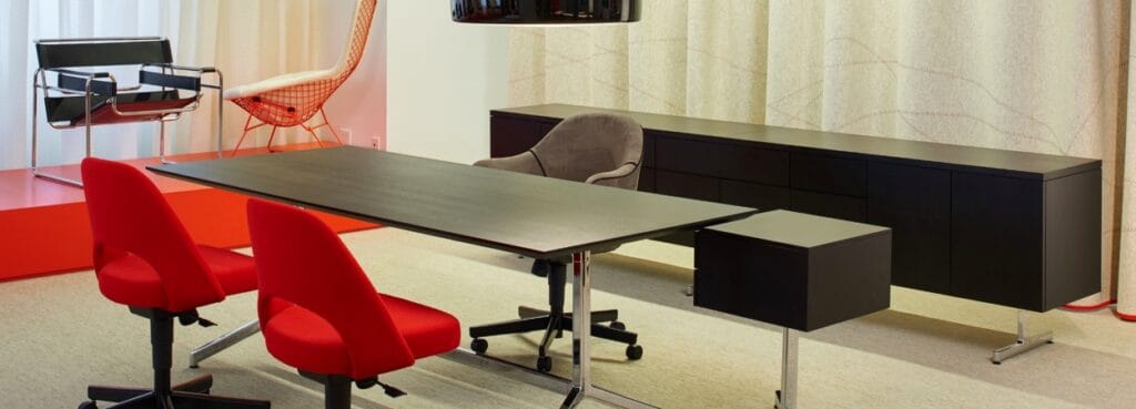 Modern office with red Saarinen Chair Armless with Swivel Base. Sleek design, perfect for home or office.