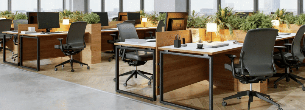 Office space featuring Fit-Out and Turnkey Solutions in Cyprus. Modern desks, ergonomic chairs, and greenery. Product-Hero-1024x369.png