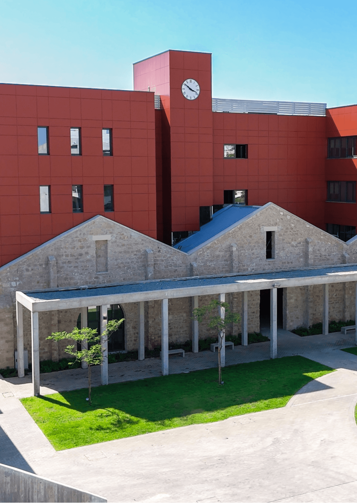 American University of Beirut, Paphos campus, University of Cyprus. Modern architecture with red panels and stone arcade.