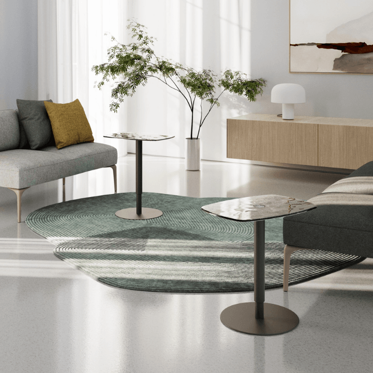 Modern living room featuring two AUTO-DRAFT side tables with marble-patterned tops and minimalist design.
