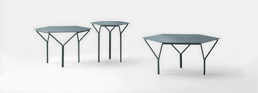Modern Kyu Coffee Table with hexagonal top and unique Y-shaped metal legs.