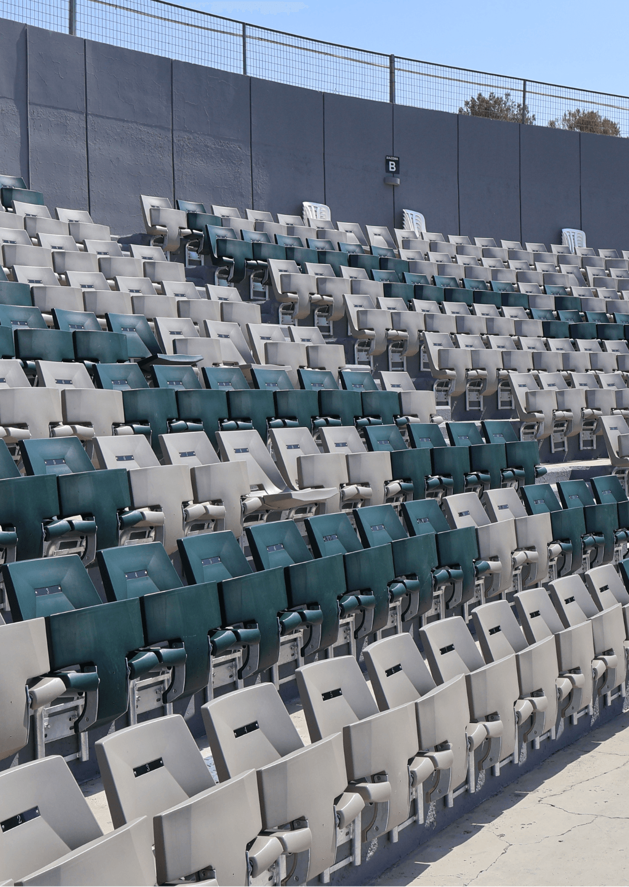 Pattichion Municipal Amphitheatre at the University of Cyprus, showcasing rows of stadium seating in green and beige.