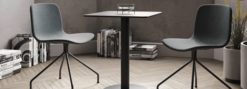 Modern Shade Table with gray chairs. Minimalist design perfect for small spaces. Shop now!
