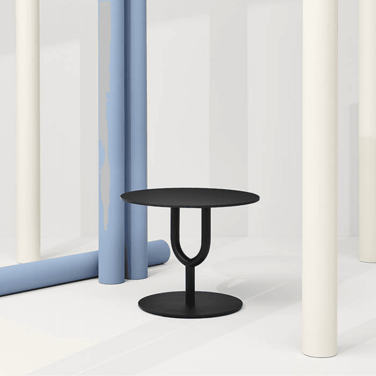 Minimalist black Diapason Table. Round top, central base, and symmetrical design. Bistro style.