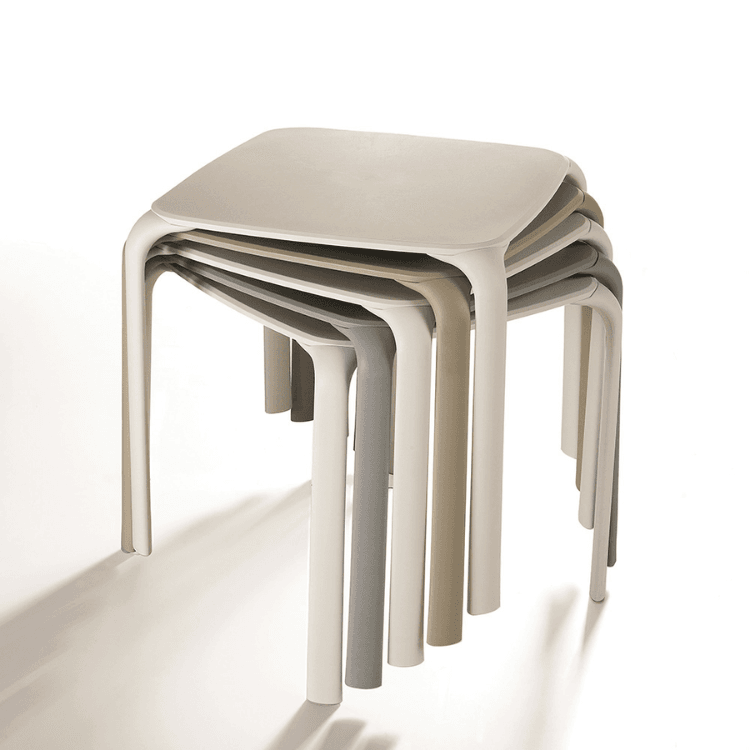Stacked Drop Table bistro tables. Modern design in neutral tones. Stackable and durable for outdoor use.