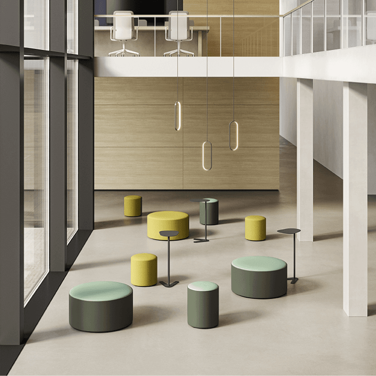 Modern office lounge with AUTO-DRAFT seating. Stylish green and yellow ottomans with tables.