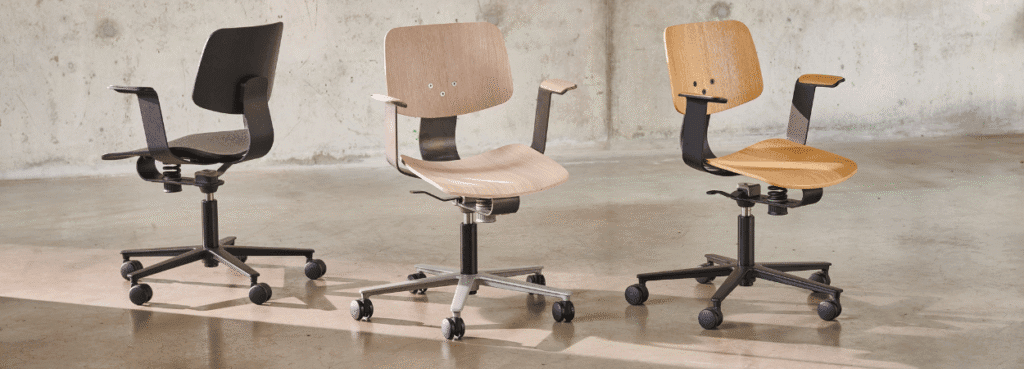 Three WiChair task chairs in black and natural wood finishes. Ergonomic, modern design for home or office.