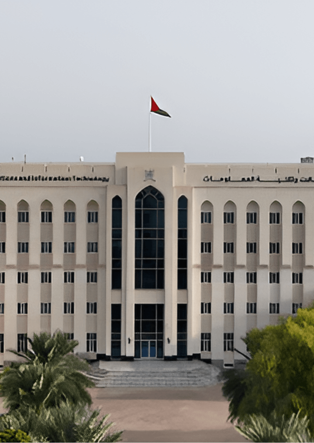 Ministry of Transport, Oman building. The Omani flag flies above this government building in Oman.