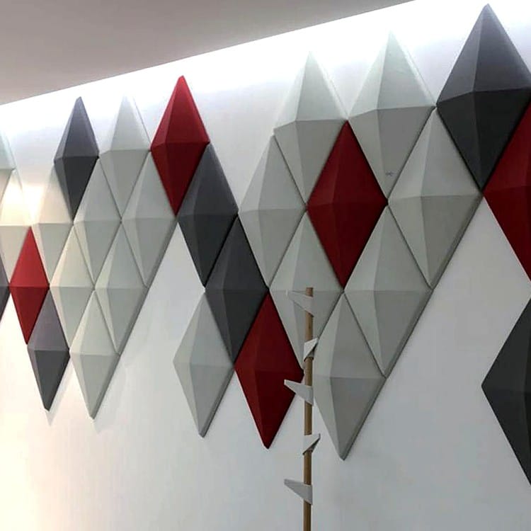 3D Diamond Grid acoustic panel wall with deep relief in a vibrant mix of white, charcoal, and crimson felt segments.