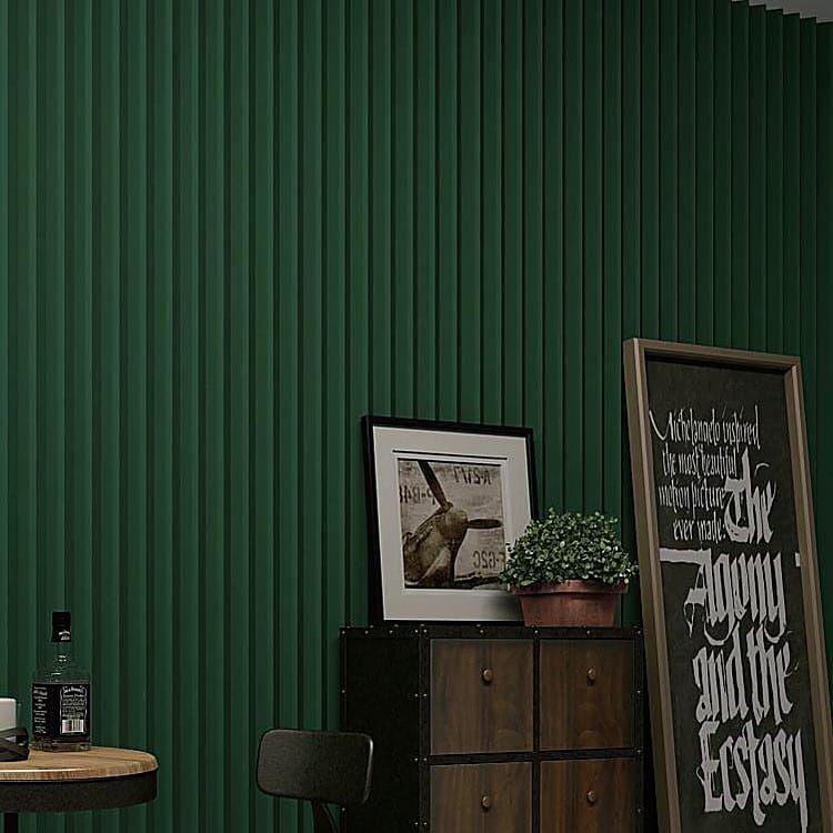 Deep green 3D V-Groove Acoustic Panel wall covering featuring vertical relief patterns in a stylish interior setting.