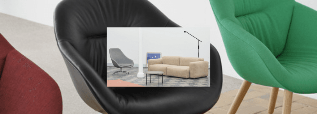 Close-up of a black leather AAL 91 lounge chair showcasing its curved silhouette and polished swivel base.