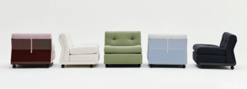 Row of colorful Amanta 1 Seater modules in varying angles, highlighting their modular, tufted design and casters.