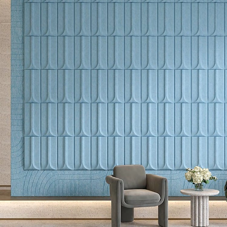 Chrono Trace acoustic wall covering with matte blue felt, showcasing a repetitive motif of embossed vertical arches.