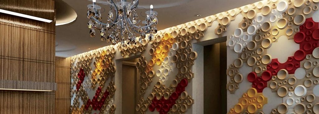 Crater Max acoustic PET felt panels with bold recessed circular craters in red, yellow, and white on a feature wall.