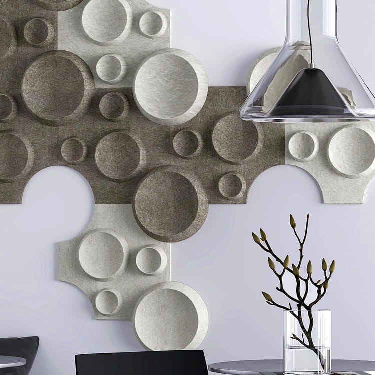Textured Crater Mini acoustic tiles featuring organic circular recesses in contrasting light and dark grey felt.
