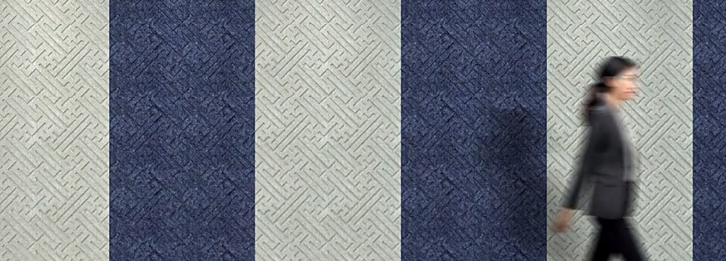 Fortune Vibe acoustic wall tiles feature a dense, interlocking key-fret maze pattern in alternating blue and beige felt.