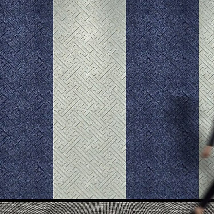 Fortune Vibe acoustic panels in alternating vertical stripes of dark navy and off-white felt with a tactile maze emboss.