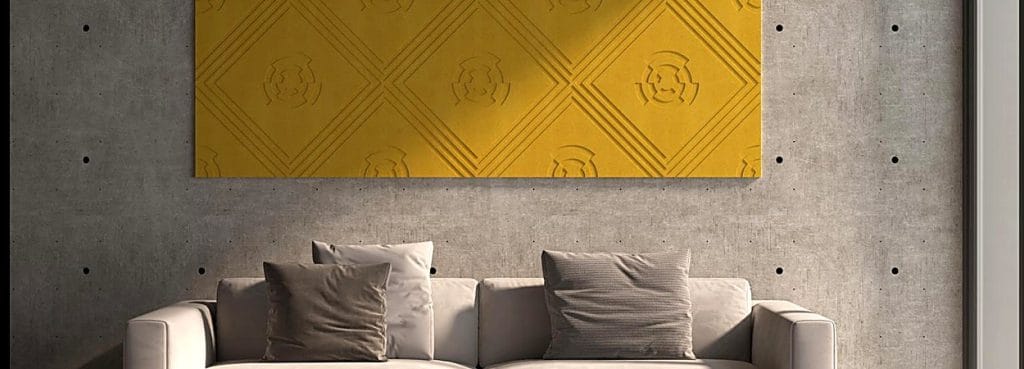Mustard yellow Fortune Wheel PET felt acoustic tile with embossed geometric circles mounted on a concrete wall.