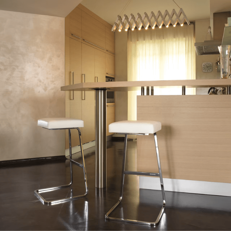 Four Seasons Barstool with white upholstered seat and chrome bent-steel frame in a modern kitchen setting.
