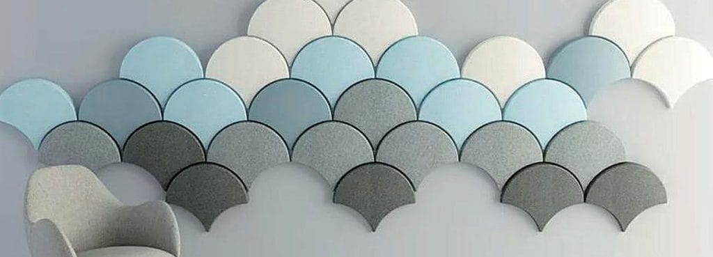 Ginkgo Flow acoustic wall panels in a scalloped, overlapping leaf pattern with blue, grey, and white PET felt textures.