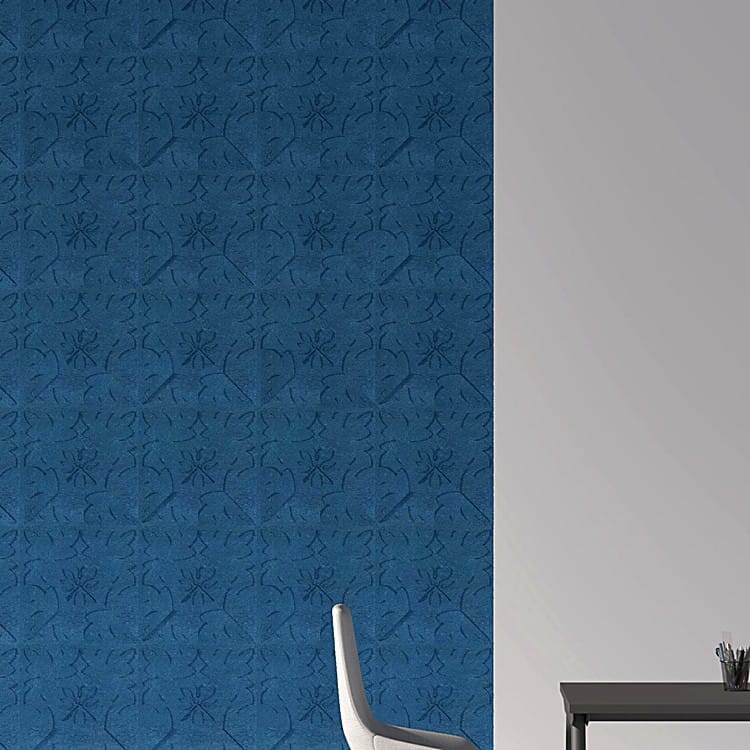 Deep blue Heart Leaf acoustic wall panels featuring intricate embossed floral rosette designs in a professional office.