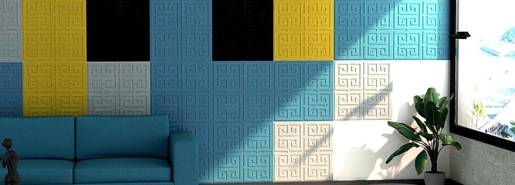 Labyrinth embossed acoustic wall tiles featuring a geometric Greek-key maze pattern in a colorful felt material.