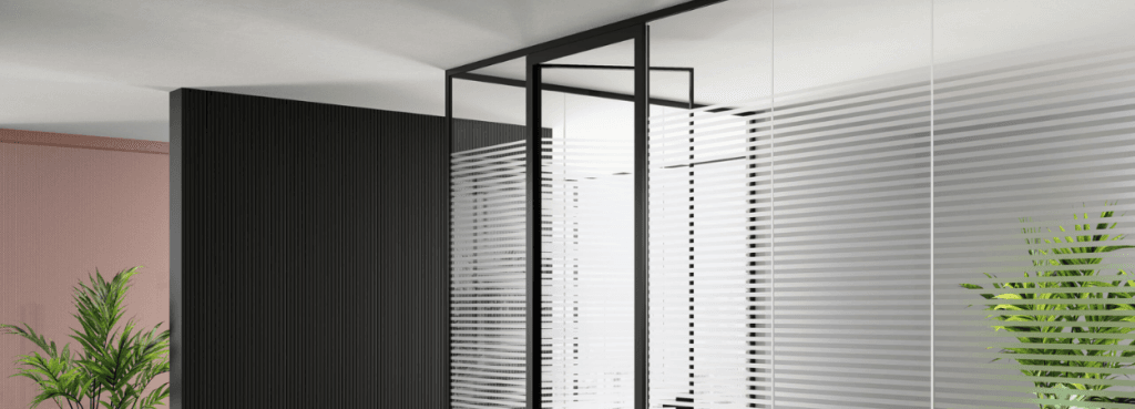 Mood M1 partition with horizontal frosted glass stripes, black frame, and adjacent fluted black and terracotta walls.