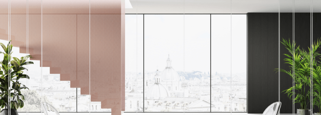 Mood M2 glass partitions organize a modern room featuring a soft blush staircase and an integrated black feature wall.