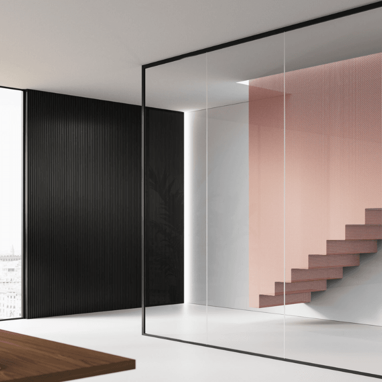 Mood MM glass partition featuring transparent panels with minimal black framing in a modern architectural interior.