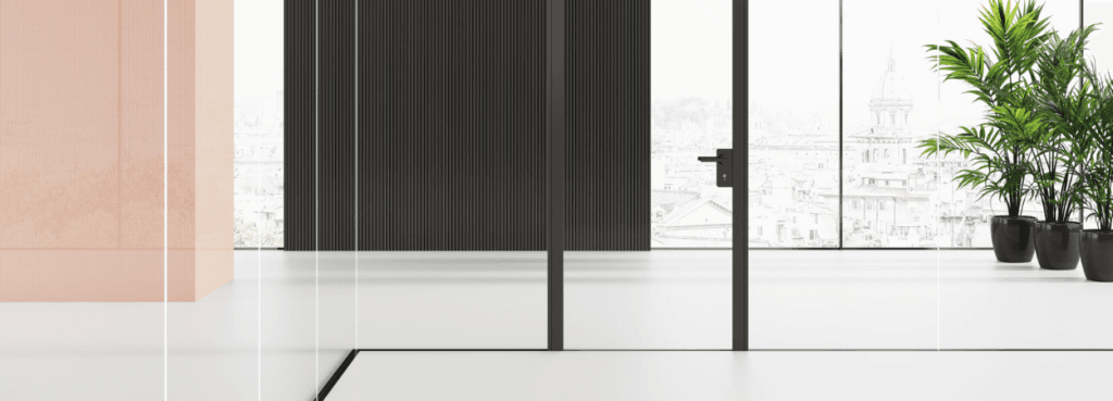 Mood MM glass partition integration with a hinged door, featuring a contrast between pastel pink and dark wood walls.
