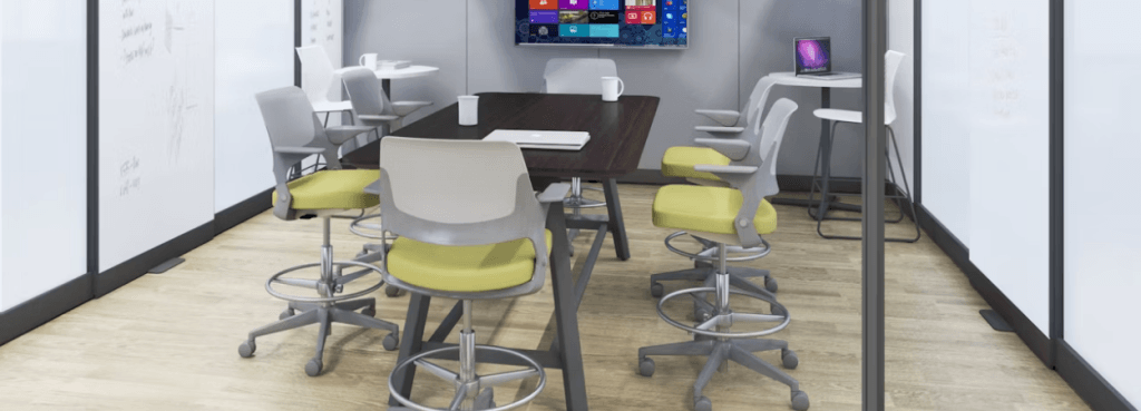 Multiple Ollo Stool units with lime green seats and grey frames arranged around a dark wood high-top meeting table.