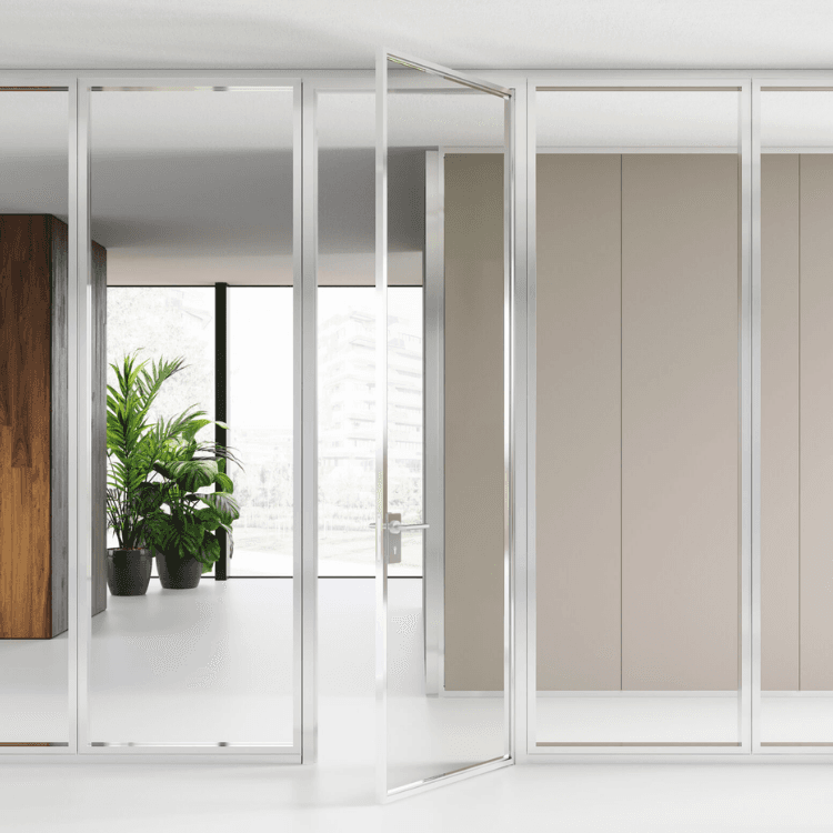 Over modular glass and wood partition wall system with a sleek aluminium frame in a modern office space.