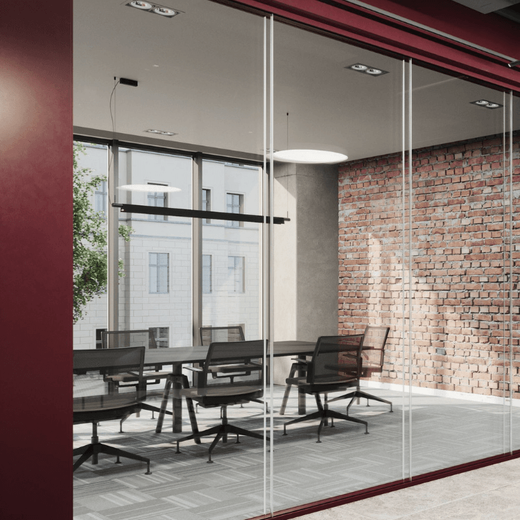 Pure Fire-Resistant System featuring slim profiles and clear glass partitions in a modern office meeting room.