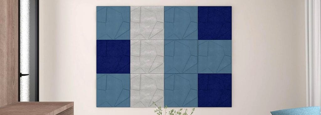 Rhythmic Layer 3D acoustic felt wall panels with overlapping geometric planes in shades of blue, grey, and navy.