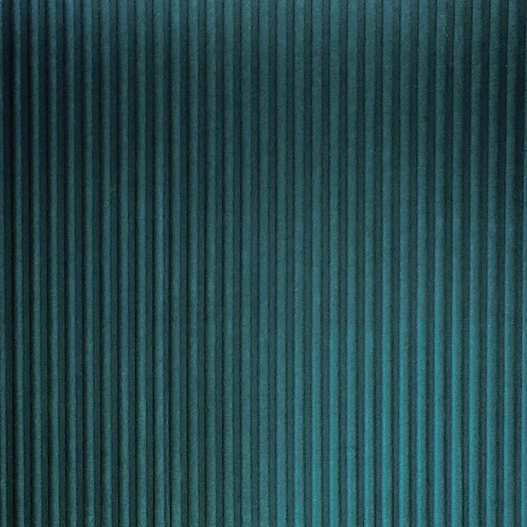 Dark teal Ripples Acoustic Panel featuring a vertical fluted felt design with soft, rhythmic relief shadows.