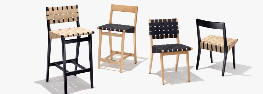 Collection of Risom Barstools and chairs displayed with varying wood finishes and woven seat colors on white background.